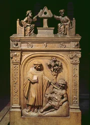 Chorgestühle, die (oben) zwei Schriftsteller an einem Pult und (unten) eine Szene der Teufelsaustreibung darstellen